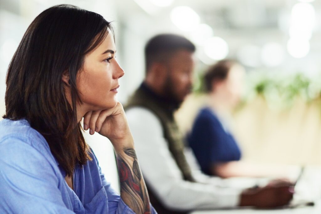 Woman considering if she should join an alumni association.